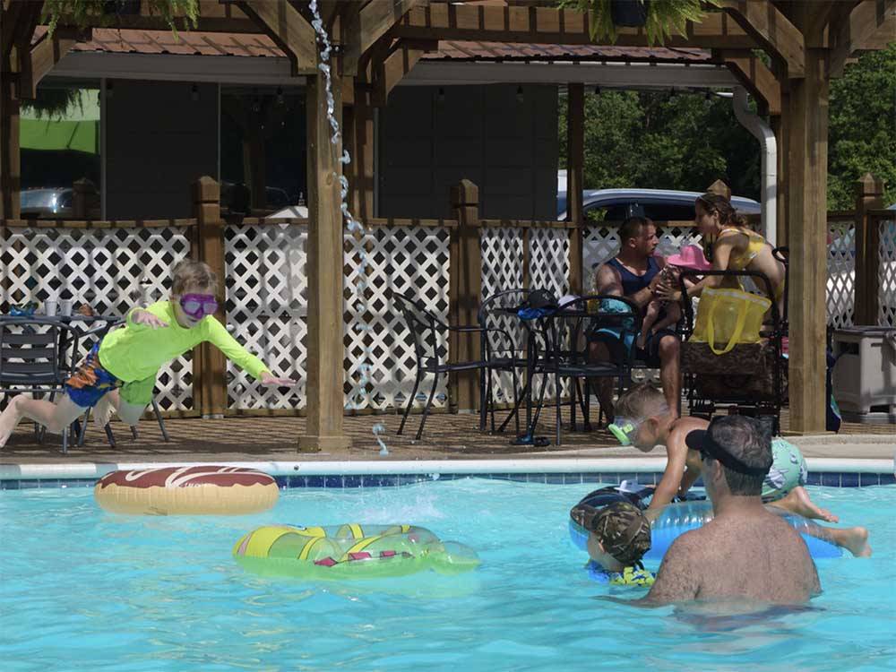 Kids playing in the pool at CAJUN RV PARK