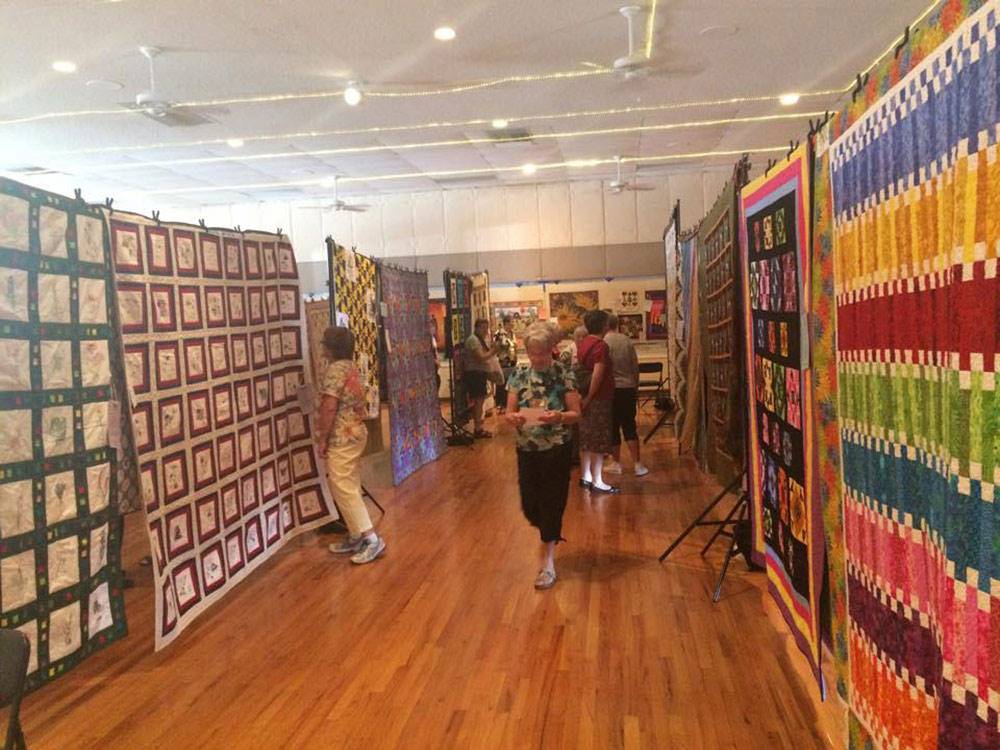 Large quilts hanging at RINCON COUNTRY WEST RV RESORT
