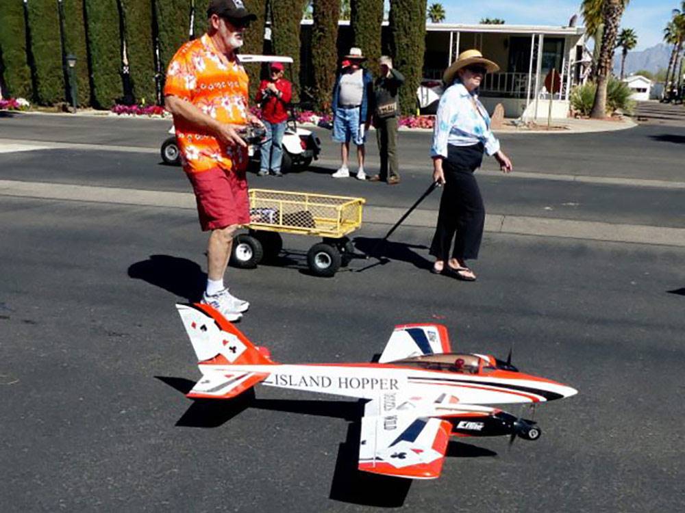 Man getting ready to fly remote controlled airplane at RINCON COUNTRY WEST RV RESORT