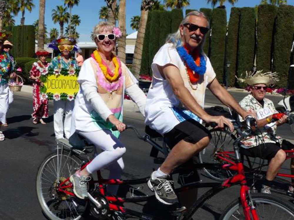 People on a bicycle parade at RINCON COUNTRY WEST RV RESORT