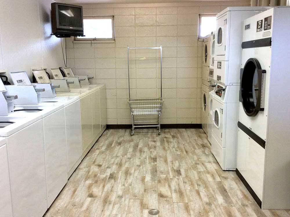 Laundry room with washers and dryers at OASIS CAMPGROUND