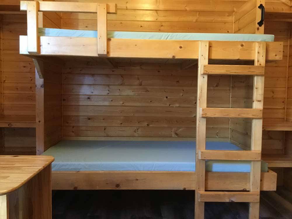 Interior view of cabin with bunk beds at OASIS CAMPGROUND