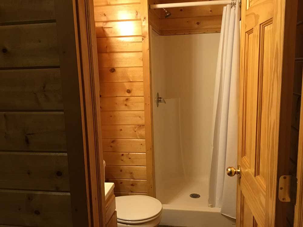 Interior of cabin toilet and shower at OASIS CAMPGROUND