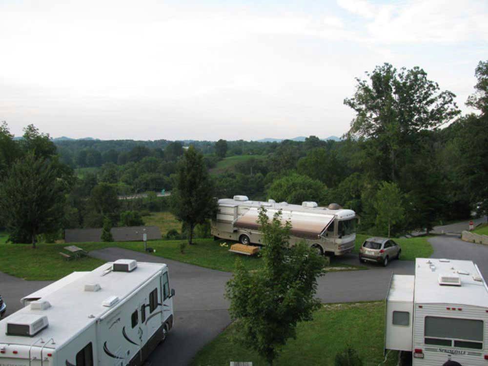 Big rigs in paved sites on grass at ASHEVILLE BEAR CREEK RV PARK