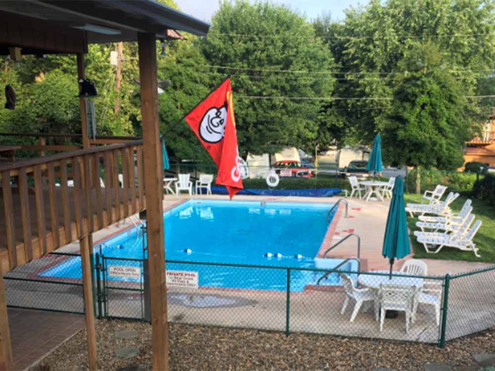 View of the swimming pool and deck area at ASHEVILLE BEAR CREEK RV PARK