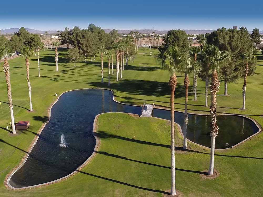 Aerial view of the pond and fountain on the golf course at WESTWIND RV & GOLF RESORT