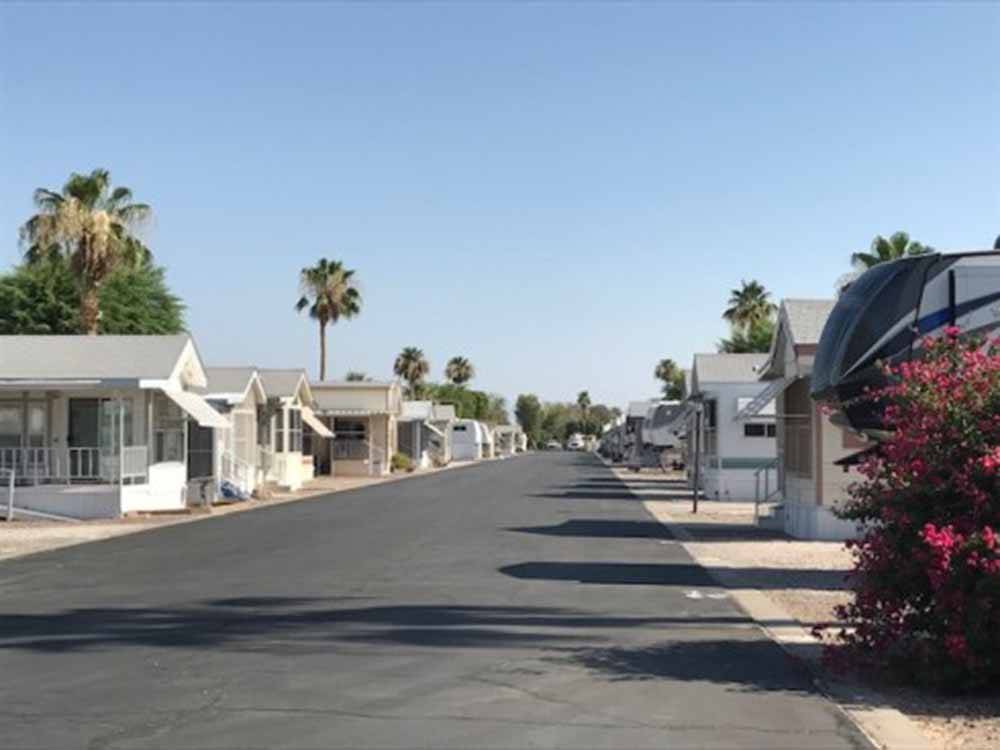 A paved road between the park models at SHANGRI-LA RV RESORT