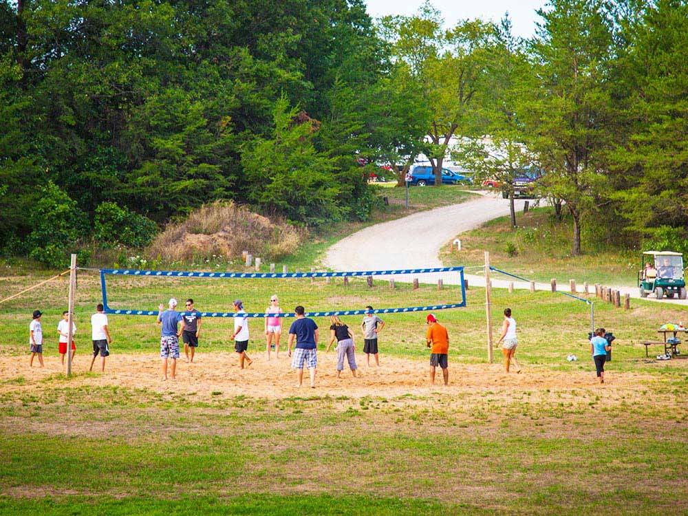 People playing volleyball at ARROWHEAD RV CAMPGROUND