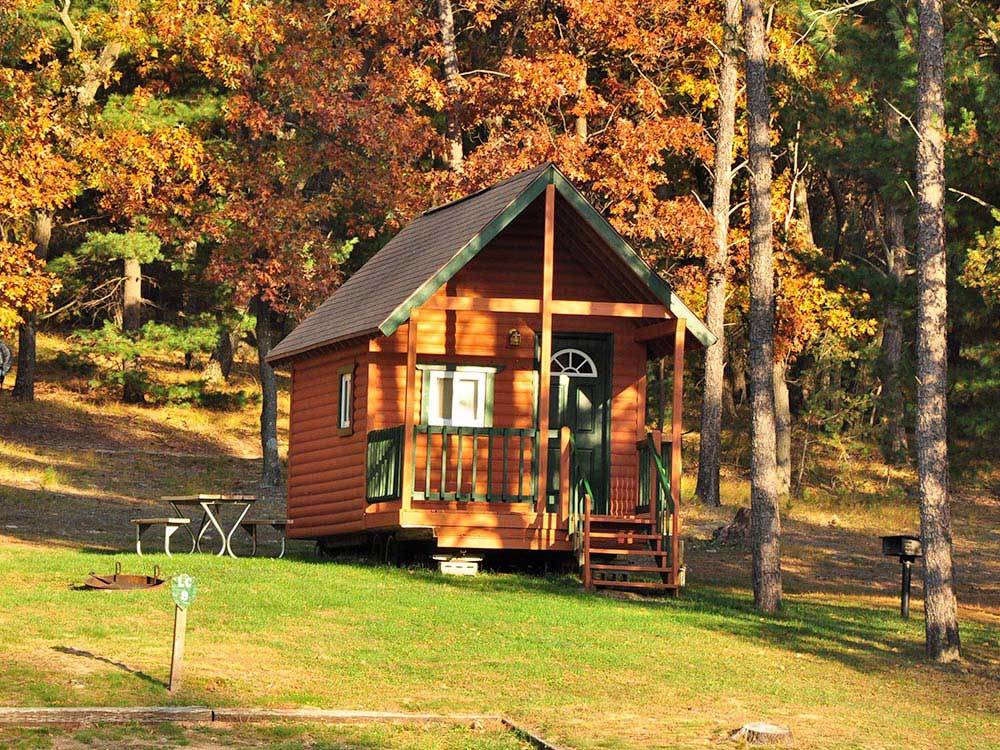Cabin with deck at ARROWHEAD RV CAMPGROUND