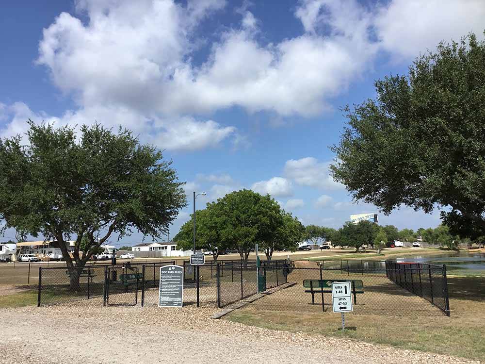 The fenced in dog area at HOUSTON WEST RV PARK