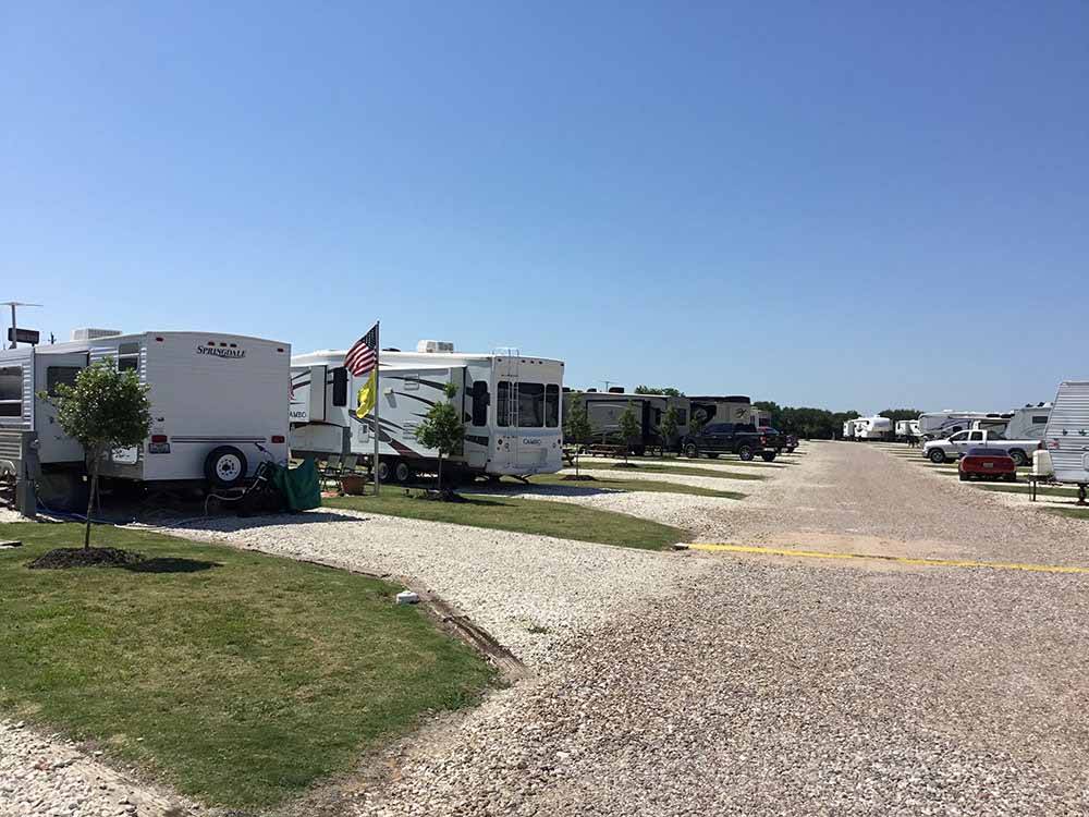 A row of gravel RV sites at HOUSTON WEST RV PARK
