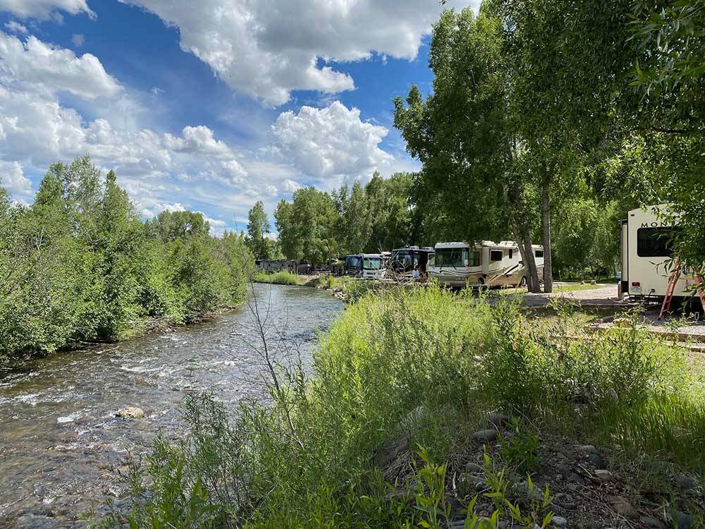 RVs parked by the water at RIO CHAMA RV PARK