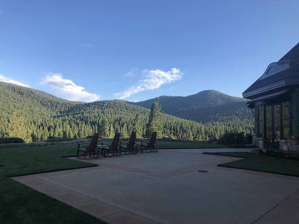 A view of the patio area and mountains at COACHLAND RV RESORT / VILLAGE CAMP TRUCKEE