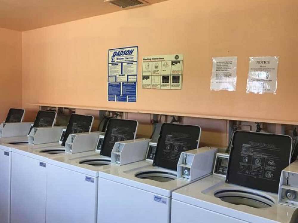 Washing machines in the laundry room at HOLIDAY PALMS RESORT