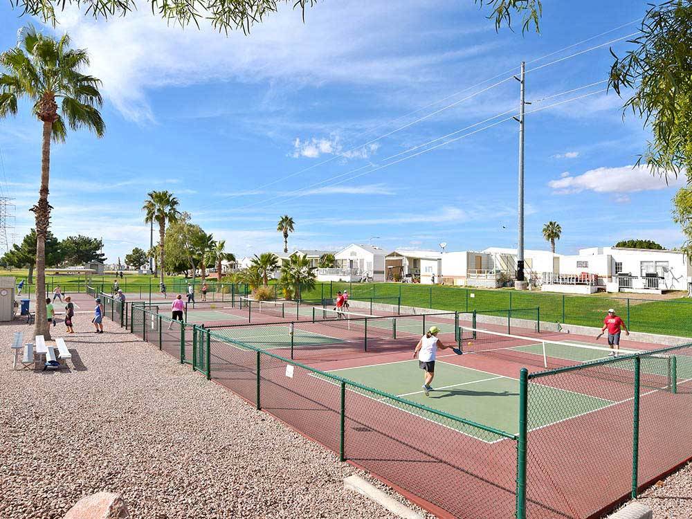 Campers playing pickleball on multiple courts at VIEWPOINT RV & GOLF RESORT