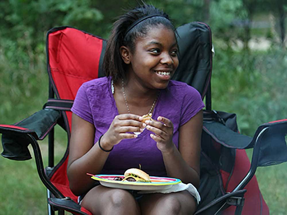Girl eating lunch at LEBANON HILLS CAMPGROUND