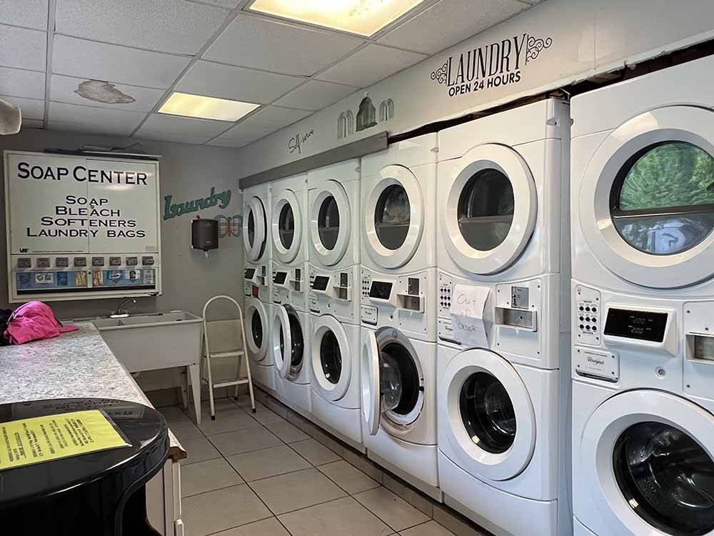The row of dryers in the laundry room at CAMP LORD WILLING RV PARK & CAMPGROUND