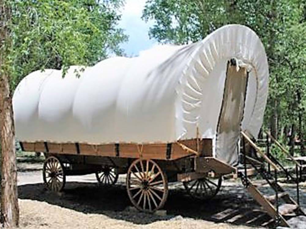 A conestoga wagon rental at DOLORES RIVER RV RESORT BY RJOURNEY