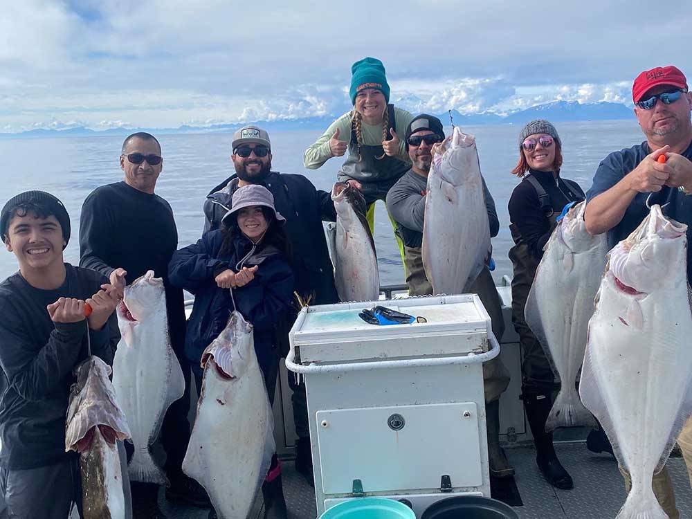 A group of anglers with their latest catches at ALASKAN ANGLER RV RESORT & CABINS