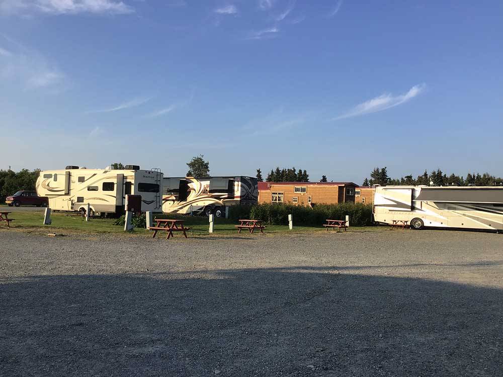 RVs parked on campground at ALASKAN ANGLER RV RESORT & CABINS