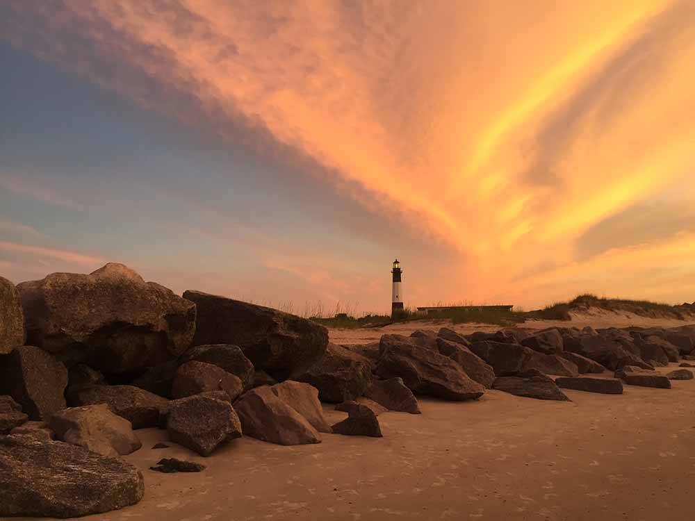 A lighthouse at dusk at RIVER'S END CAMPGROUND