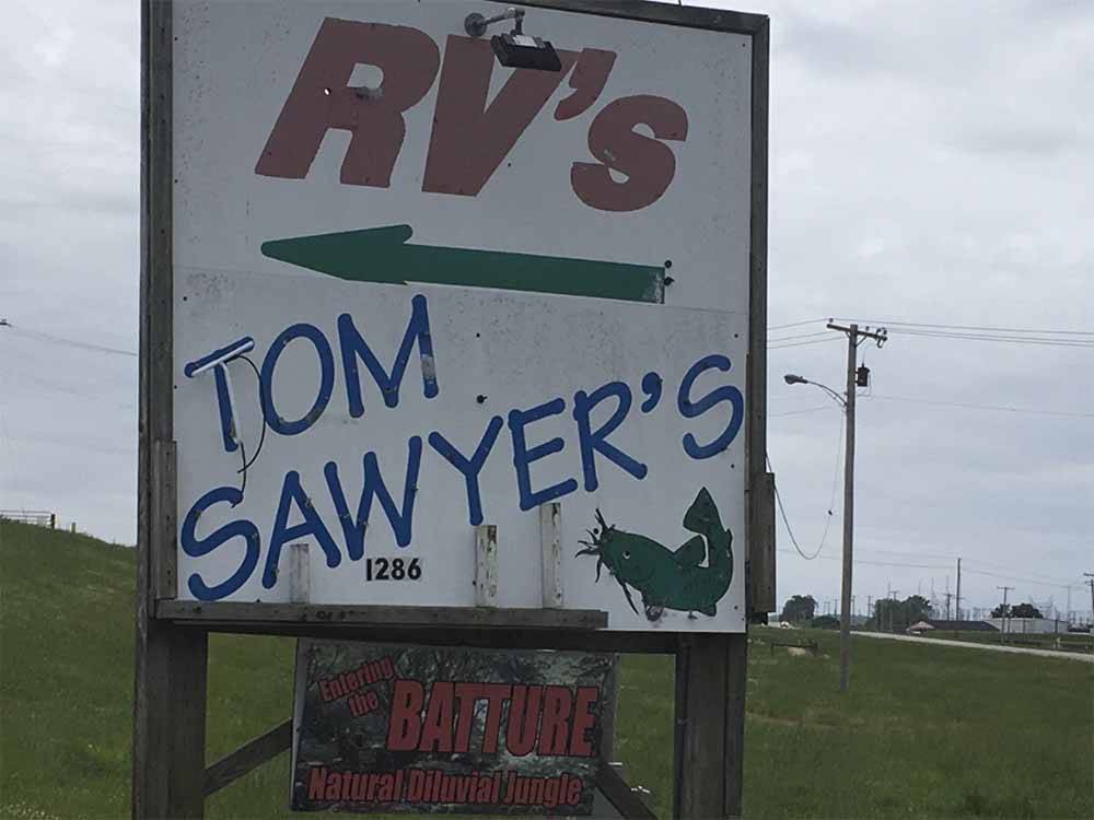The front entrance sign at TOM SAWYER'S RV PARK