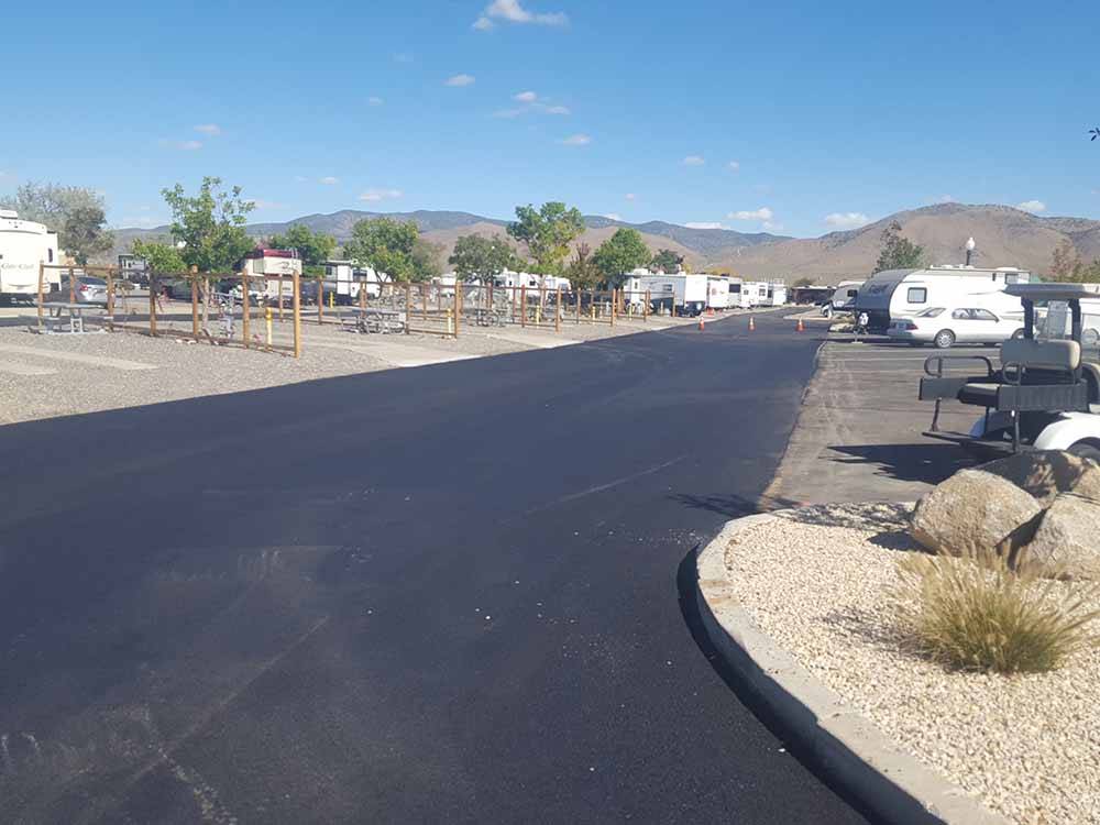 A paved road going between the RV sites at SILVER CITY RV RESORT