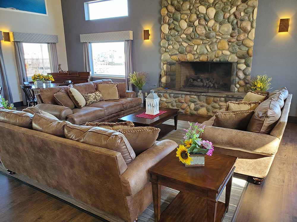 Three couches in front of the fireplace at SILVER CITY RV RESORT