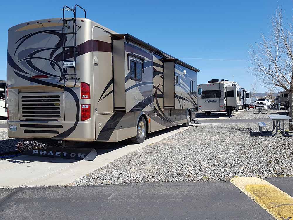 A motorhome in a paved RV site at SILVER CITY RV RESORT