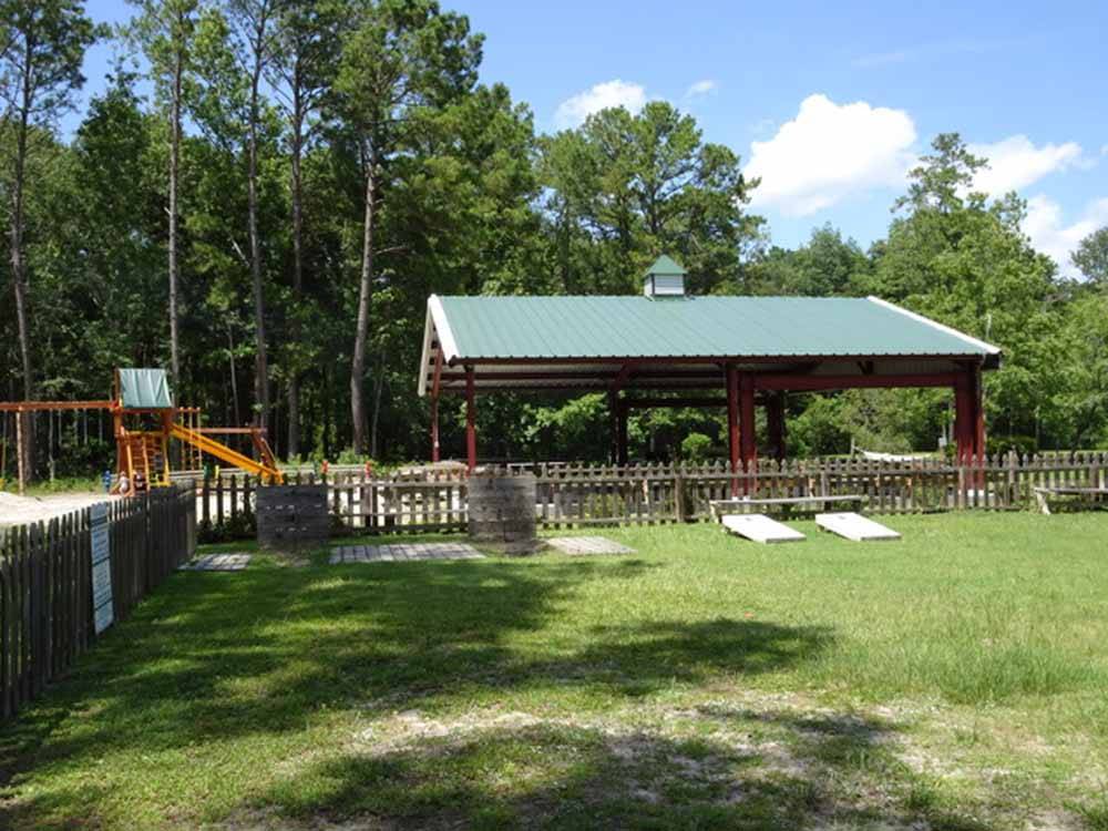 The horseshoe and cornhole area at LAKE AIRE RV PARK & CAMPGROUND