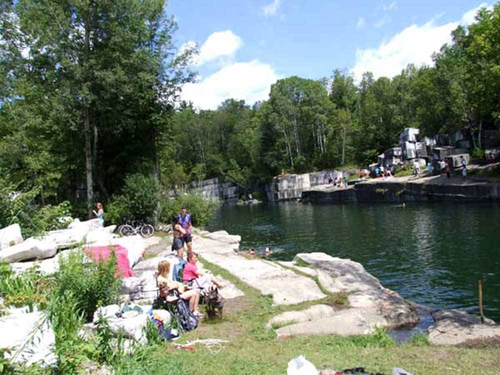People playing in the water filled rock quarry at DORSET RV PARK