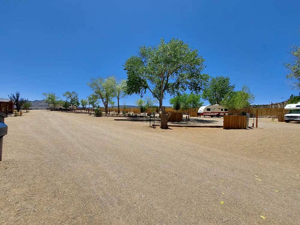 A dirt road leading to RV spots at CANYONS OF ESCALANTE RV PARK