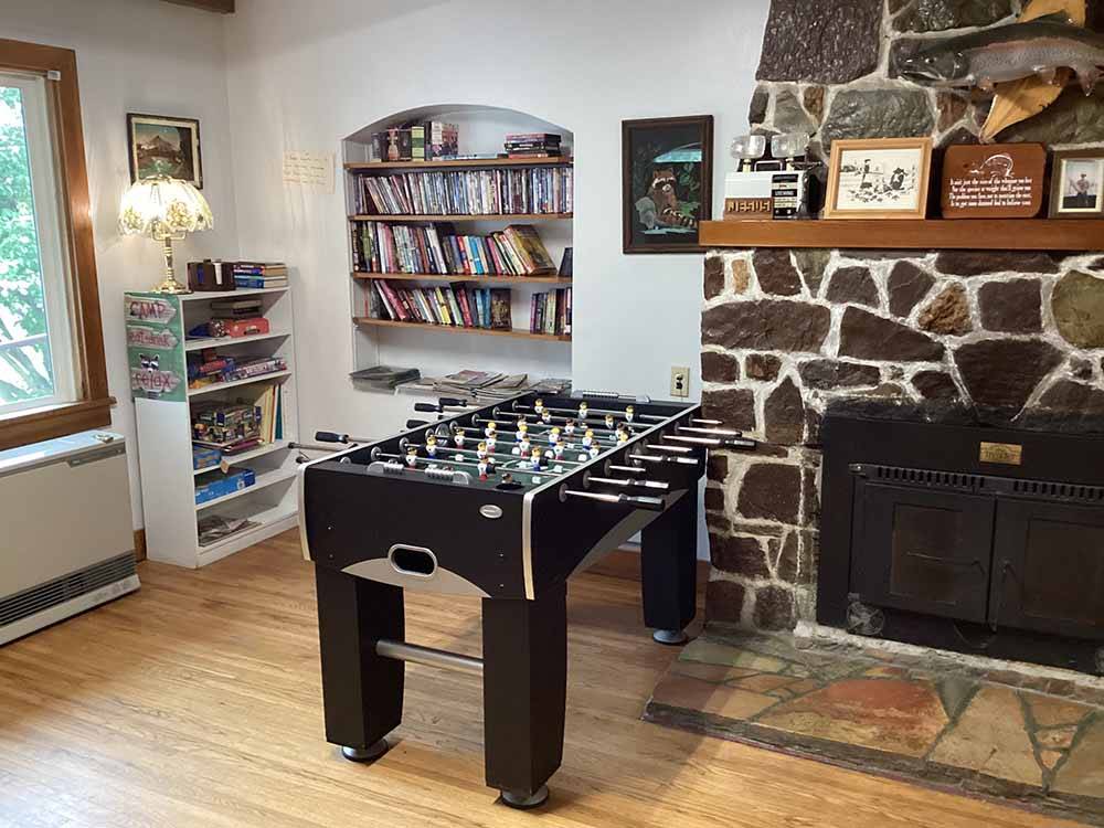 The foosball table by the fireplace at RIVERFRONT RV PARK