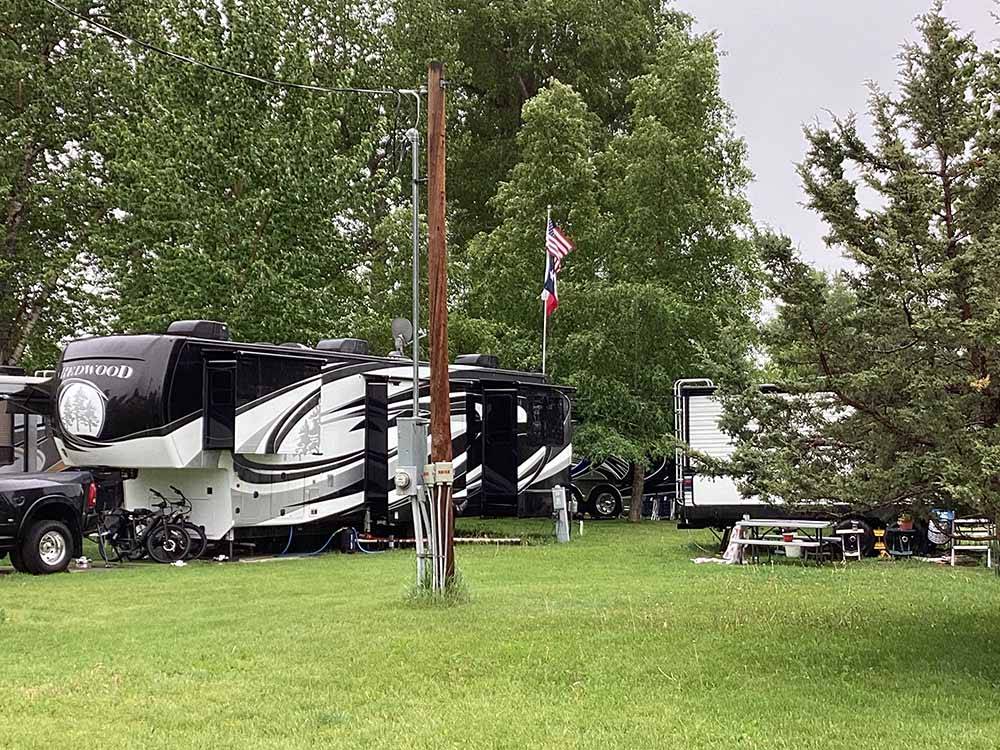 A group of grassy RV sites at RIVERFRONT RV PARK
