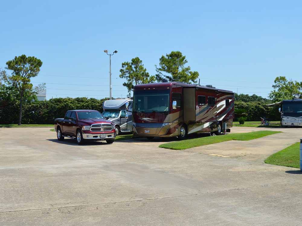 A couple of paved pull thru RV sites at TRADERS VILLAGE RV PARK