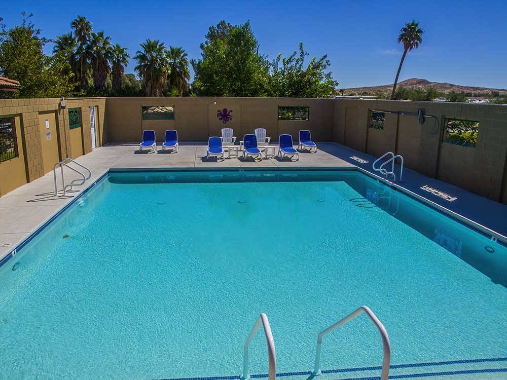 Large pool onsite for guests at TWENTYNINE PALMS RESORT RV PARK AND COTTAGES
