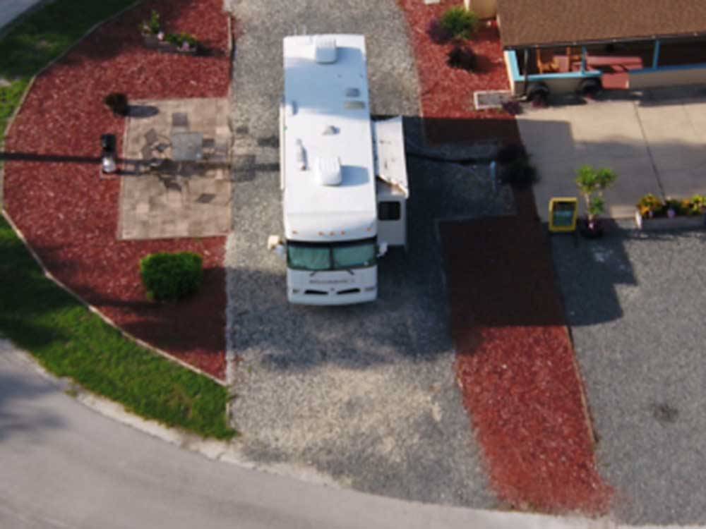 A drone shot of a large motorhome parked at DAYTONA RV OASIS