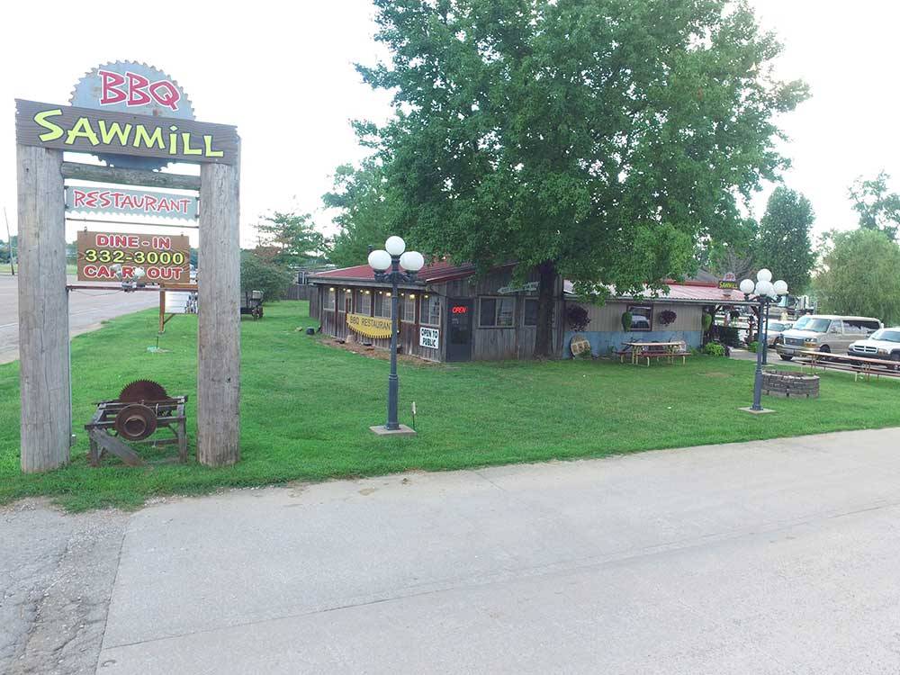 Barbeque restaurant alongside large advertising sign at CAHOKIA RV PARQUE