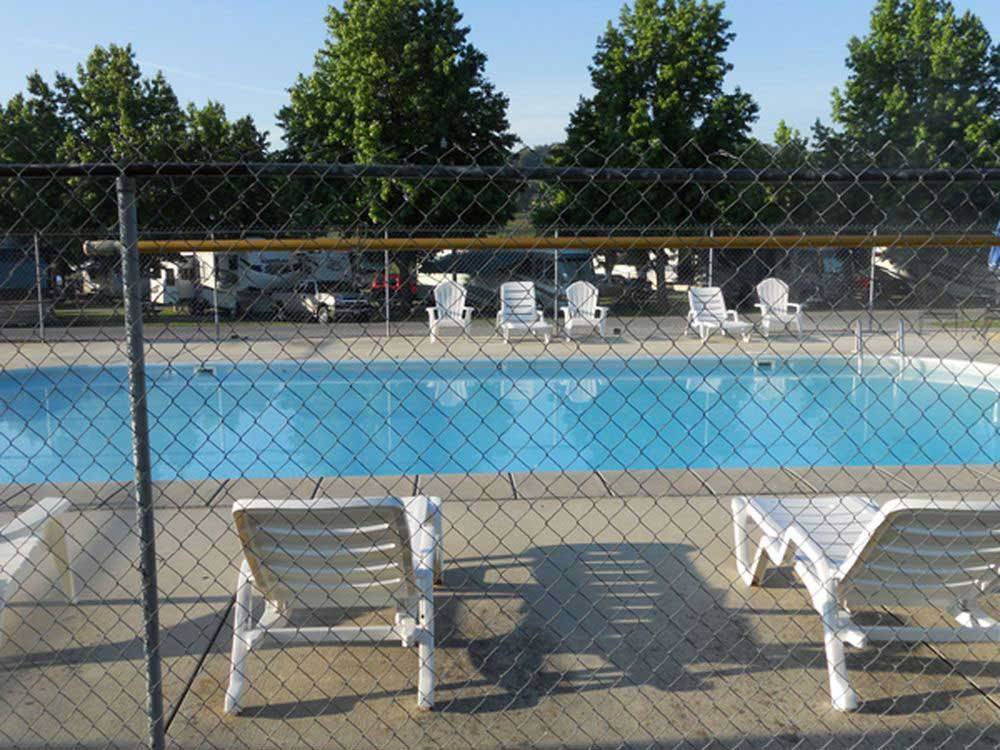 Swimming pool with outdoor seating at FORT CHISWELL RV PARK