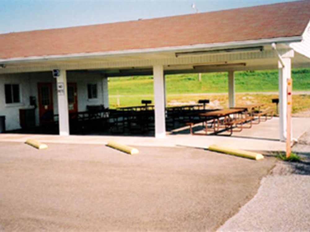 Picnic tables under the pavilion at FORT CHISWELL RV PARK