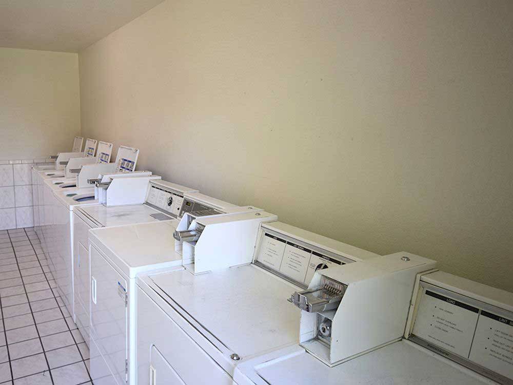Laundry room with washers and dryers at KEYSTONE RV PARK