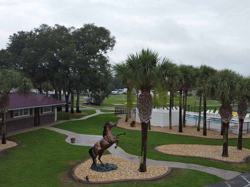 A statue of a horse in front of the main building at OCALA SUN RV RESORT