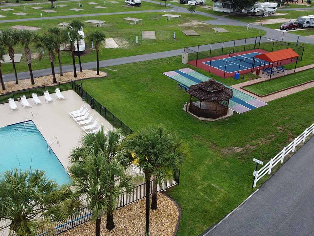 A view of the swimming pool and play courts at OCALA SUN RV RESORT