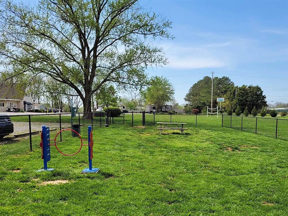 The fenced in pet area at CLARKSVILLE RV RESORT BY RJOURNEY