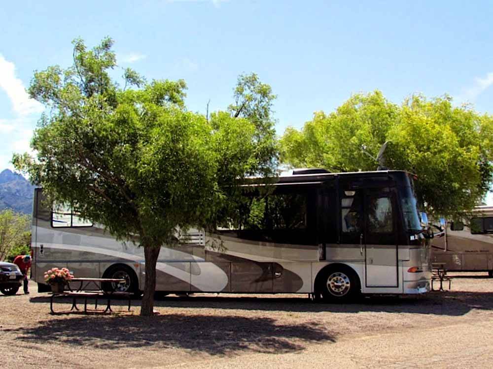 Class A motorhome parked in a gravel RV site at BLAKE RANCH RV PARK