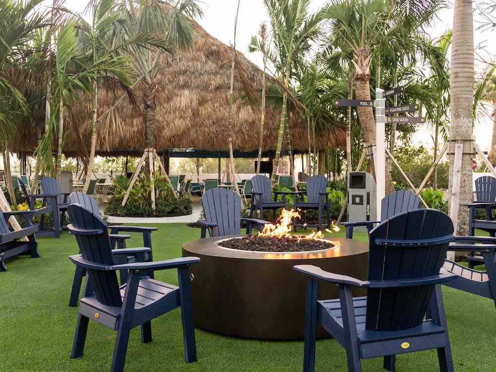Chairs and a large fire pit at SUN OUTDOORS SUGARLOAF KEY