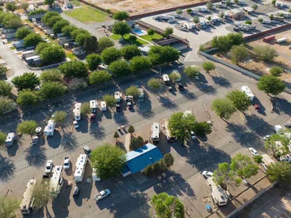 Aerial view of RVs in camp surrounded by trees at TOWN & COUNTRY RV PARK