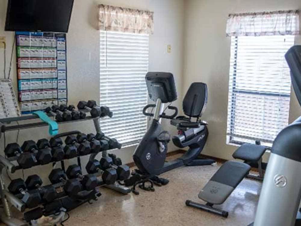 Weight room with exercise bike at TOWN & COUNTRY RV PARK