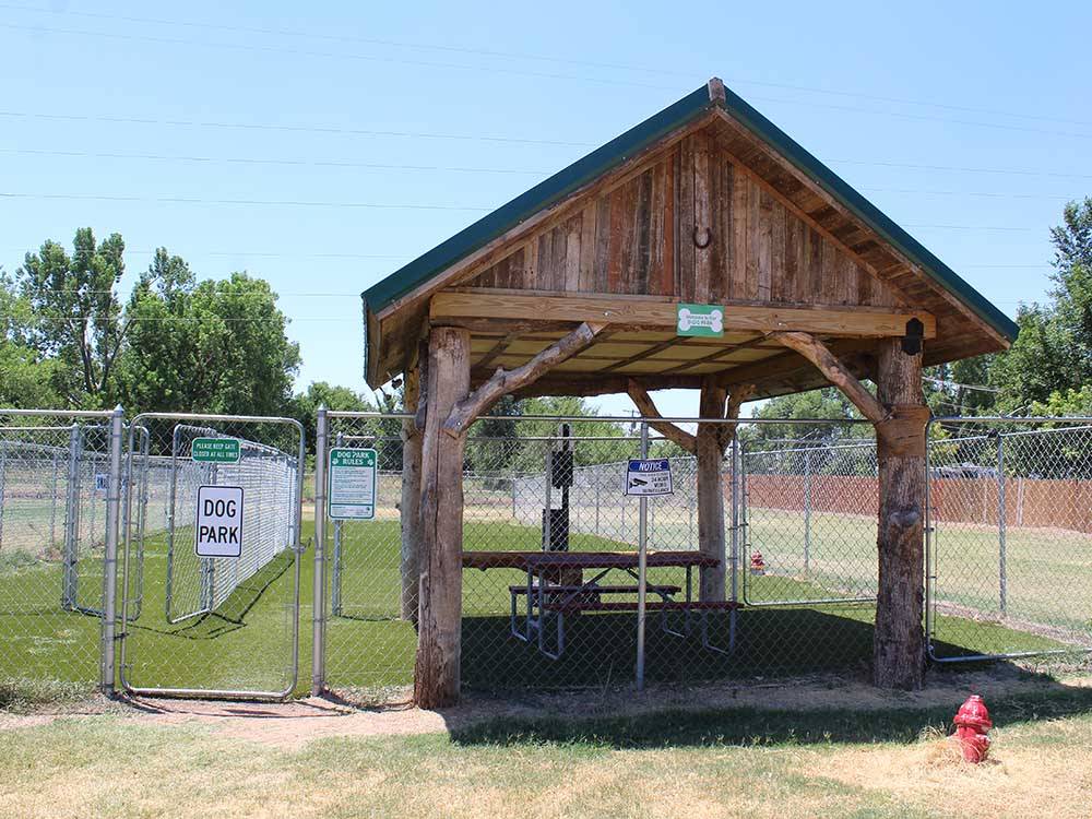 The covered fenced in pet area at ROCKWELL RV PARK