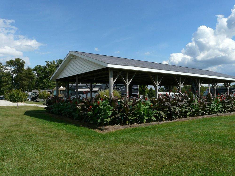 The pavilion with flowers around it at SHIPSHEWANA CAMPGROUND SOUTH PARK